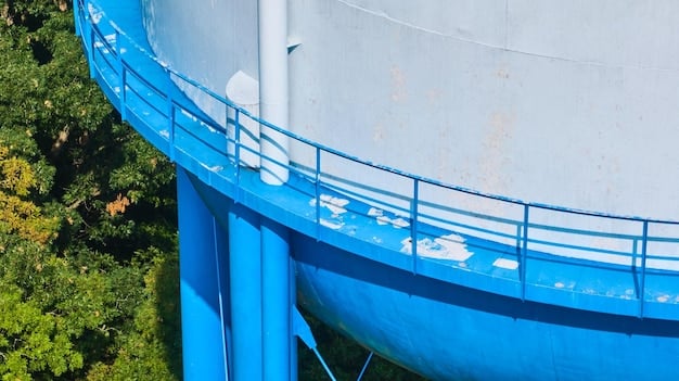 Exterior of a water treatment plant with large holding tanks and industrial piping. The image suggests the scale and complexity of water treatment and distribution systems, and the need for maintenance and upgrades.