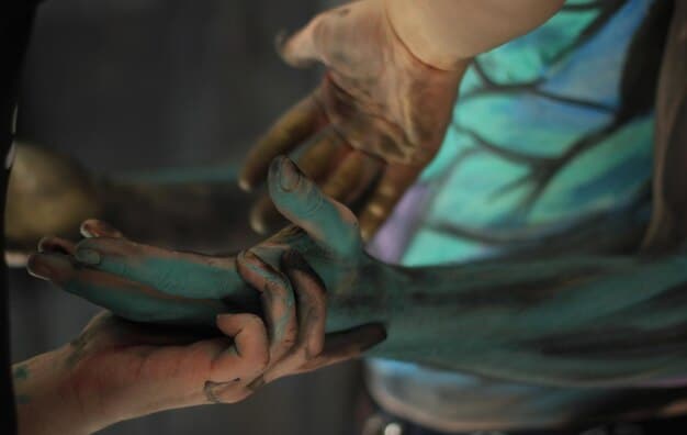 A close-up shot of a cosplayer's hands meticulously working on a piece of armor. The armor is clearly made from affordable materials like EVA foam, but the craftsmanship and attention to detail make it look impressive. The background is a cluttered crafting space, emphasizing the DIY nature of budget cosplay.