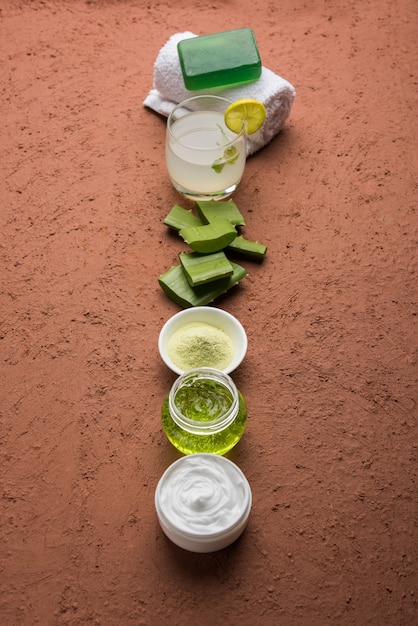 Close-up of various Korean moisturizers, including gel, cream, and lotion textures, displayed next to ingredients like aloe vera and green tea. The moisturizers are in sleek, minimalist packaging.