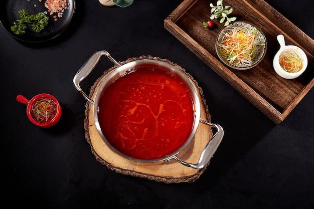 A close-up shot of a steaming bowl of Kimchi Jjigae, showcasing the rich red broth, tofu, pork belly, and scallions. The bowl is set on a traditional Korean placemat with side dishes like kimchi and pickled radishes.