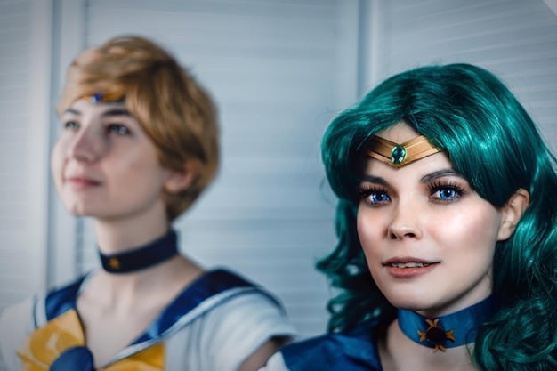 A close-up shot of two anime film festival attendees in elaborate cosplay costumes, posing for a photo. The focus is on the detail and craftsmanship of the costumes.