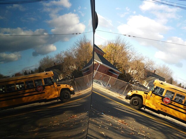 A split image showing two different commuting scenarios: on one side, a packed bus with people using their phones; on the other side, a person happily cycling on a bike path with trees and green scenery.