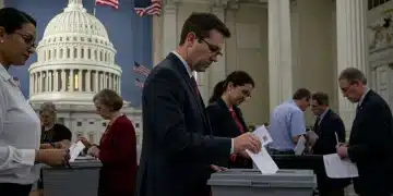 Voters casting ballots in 2026 midterm elections at a polling station, US flag in background